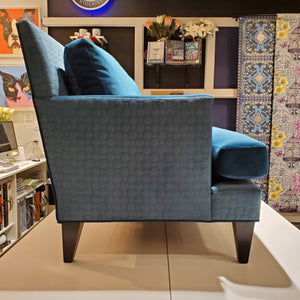 side view of custom sofa in brilliant Peacock Teal velvet and quilted geometric pattern 