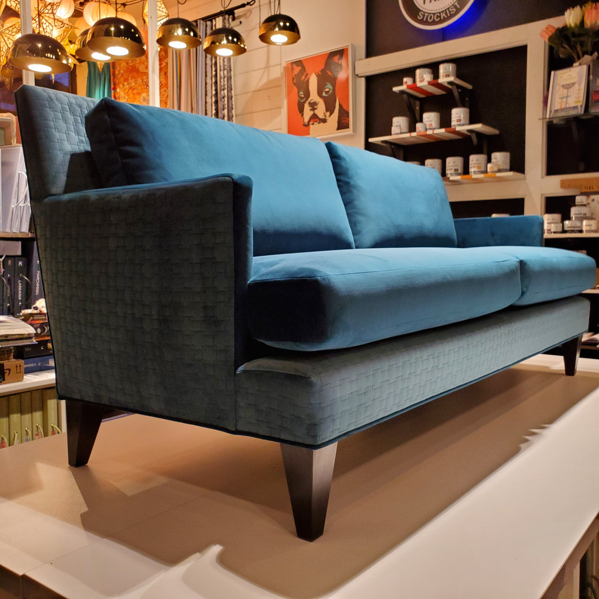 custom sofa in brilliant Peacock Teal velvet and quilted geometric pattern 